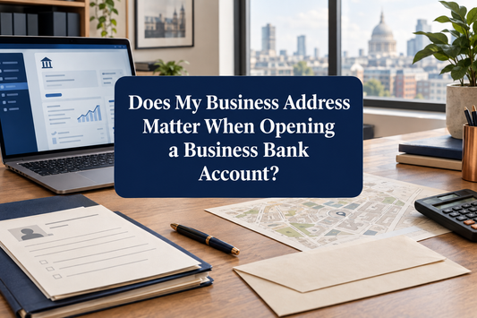 UK business banking desk with company documents, identity-check paperwork, calculator and address verification materials.