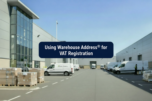Modern UK warehouse estate with loading bays, delivery vans, pallets and a centred banner reading “Using Warehouse Address® for VAT Registration”